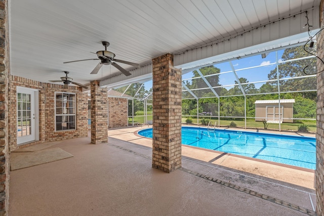 2741 Creeks Edge Ln, Navarre, FL 32566 - outdoor pool with a patio, a ceiling fan, and glass enclosure