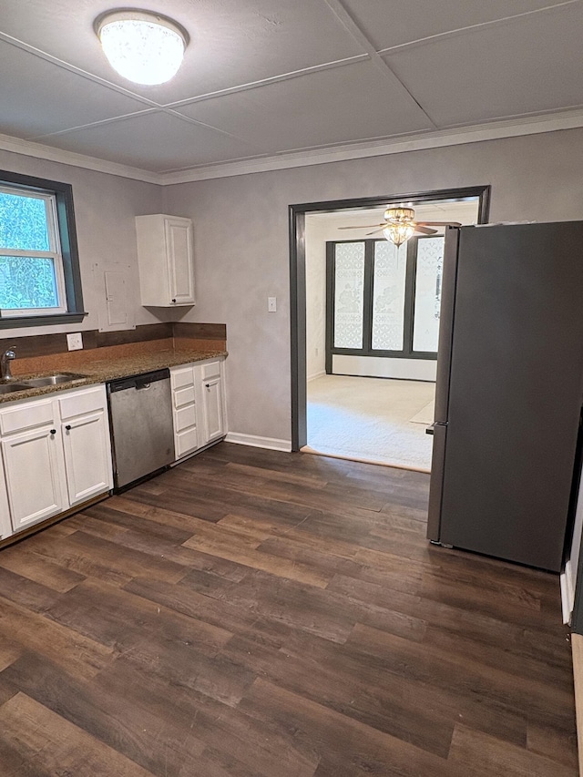 914 Georgia St, Crestview, FL 32536 - kitchen featuring stainless steel dishwasher, freestanding refrigerator, white cabinets, crown molding, and a sink