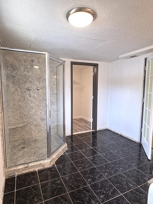 914 Georgia St, Crestview, FL 32536 - full bath featuring a shower stall, a textured ceiling, baseboards, and marble finish floors