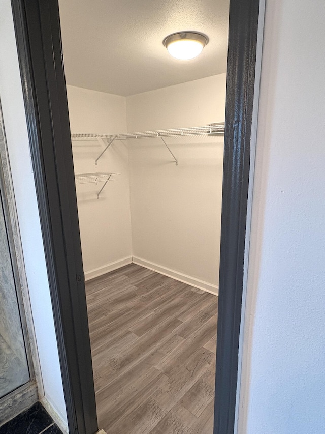 914 Georgia St, Crestview, FL 32536 - walk in closet featuring dark wood-style flooring