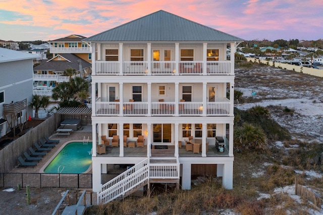 330 Tang O Mar Dr, Destin, FL 32550 - rear view of house featuring a balcony, a fenced backyard, a patio, a metal roof, and outdoor lounge area