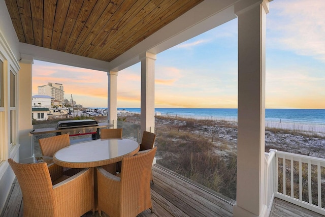 330 Tang O Mar Dr, Destin, FL 32550 - balcony at dusk featuring view of water and beach, area for grilling, and outdoor dining space