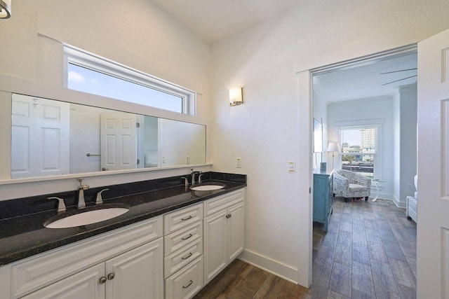 330 Tang O Mar Dr, Destin, FL 32550 - bathroom featuring double vanity, healthy amount of natural light, and wood finished floors
