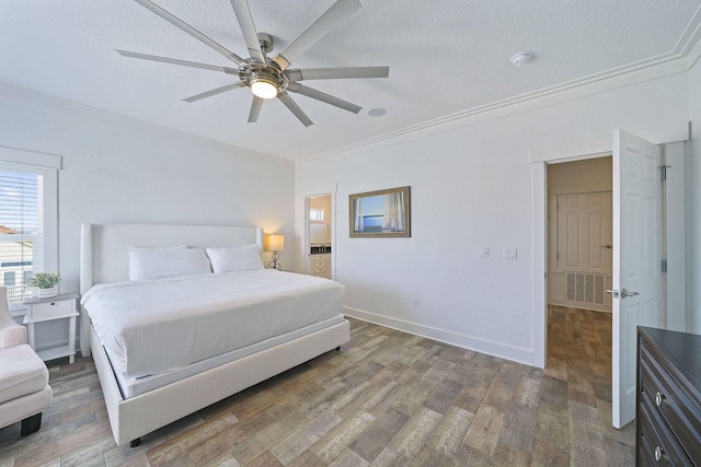 330 Tang O Mar Dr, Destin, FL 32550 - bedroom with ornamental molding, wood finished floors, a ceiling fan, and a textured ceiling