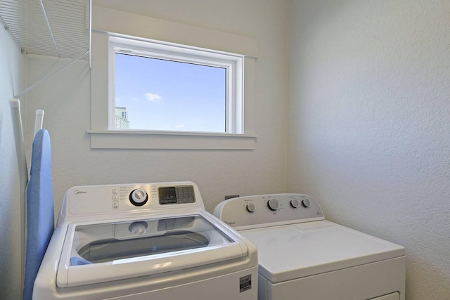 330 Tang O Mar Dr, Destin, FL 32550 - laundry room with separate washer and dryer and a textured wall