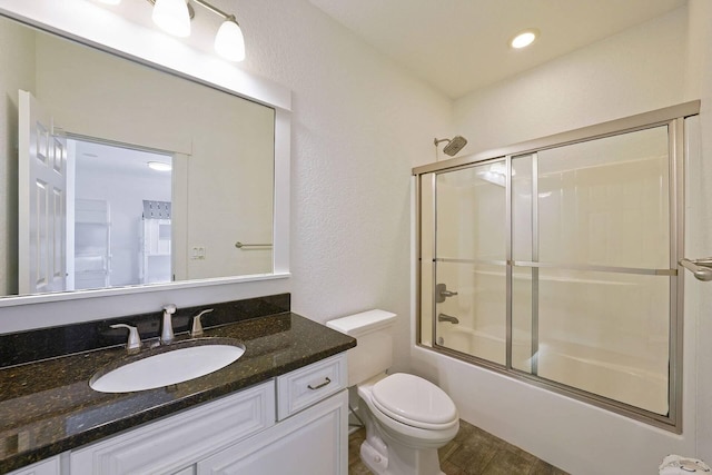 330 Tang O Mar Dr, Destin, FL 32550 - full bathroom with vanity, enclosed tub / shower combo, and wood finished floors