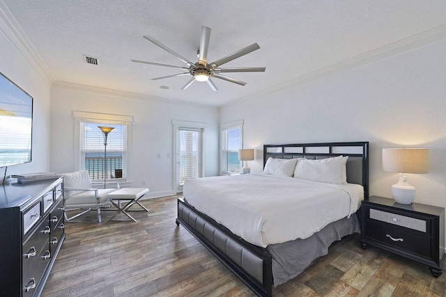 330 Tang O Mar Dr, Destin, FL 32550 - bedroom featuring crown molding, dark wood-type flooring, ceiling fan, access to outside, and a textured ceiling