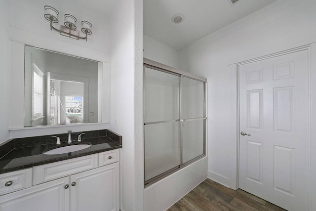330 Tang O Mar Dr, Destin, FL 32550 - full bathroom with vanity, combined bath / shower with glass door, and wood finished floors