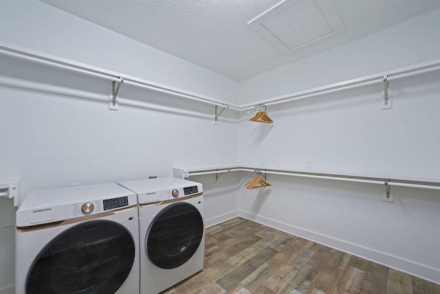 330 Tang O Mar Dr, Destin, FL 32550 - laundry room featuring washer and clothes dryer, wood finished floors, attic access, and a textured ceiling