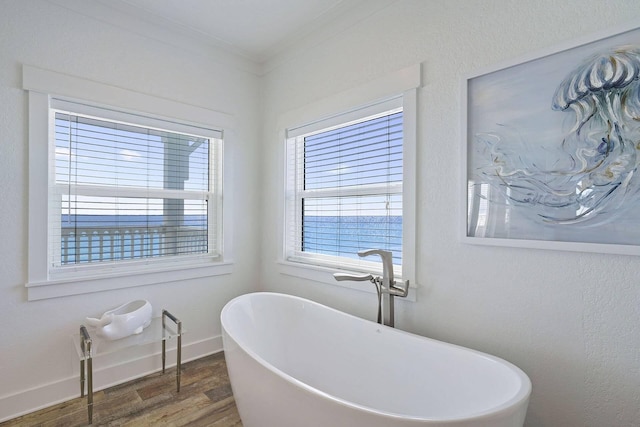 330 Tang O Mar Dr, Destin, FL 32550 - bathroom with wood finished floors, a freestanding tub, and crown molding