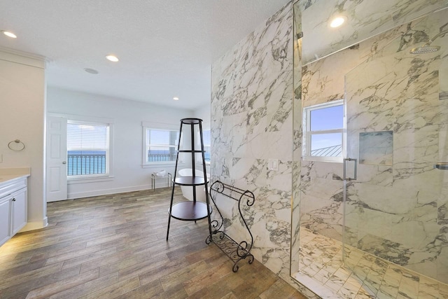330 Tang O Mar Dr, Destin, FL 32550 - full bath with a marble finish shower, plenty of natural light, vanity, wood finished floors, and recessed lighting
