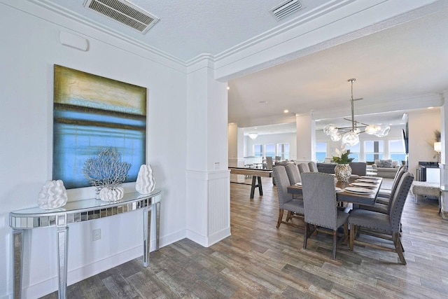 330 Tang O Mar Dr, Destin, FL 32550 - dining room with ornamental molding, wood finished floors, a chandelier, and plenty of natural light