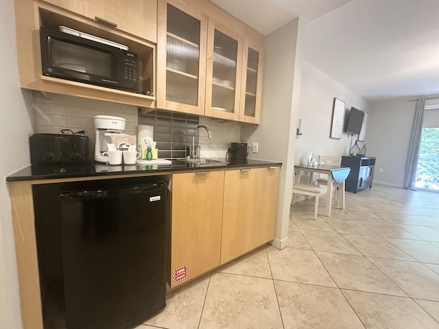 9700 Grand Sandestin Blvd Unit 4215, Miramar Beach, FL 32550 - kitchen featuring decorative backsplash, dark countertops, dishwashing machine, black microwave, and light tile patterned floors