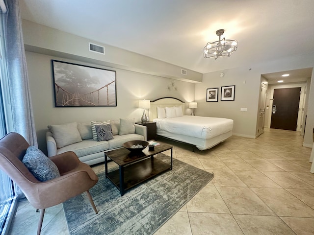 9700 Grand Sandestin Blvd Unit 4215, Miramar Beach, FL 32550 - bedroom with light tile patterned floors and a chandelier