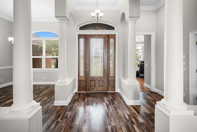 203 Landings Dr, Lynn Haven, FL 32444 - entrance foyer featuring decorative columns, dark wood finished floors, crown molding, baseboards, and a high ceiling
