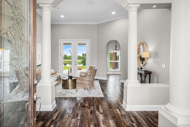 203 Landings Dr, Lynn Haven, FL 32444 - entryway with ornate columns, crown molding, wood finished floors, recessed lighting, and arched walkways