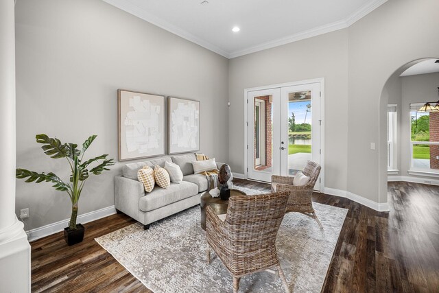 203 Landings Dr, Lynn Haven, FL 32444 - living room featuring arched walkways, plenty of natural light, baseboards, ornamental molding, and dark wood finished floors
