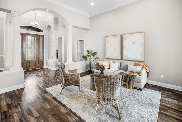 203 Landings Dr, Lynn Haven, FL 32444 - living room with ornate columns, wood finished floors, arched walkways, recessed lighting, and baseboards
