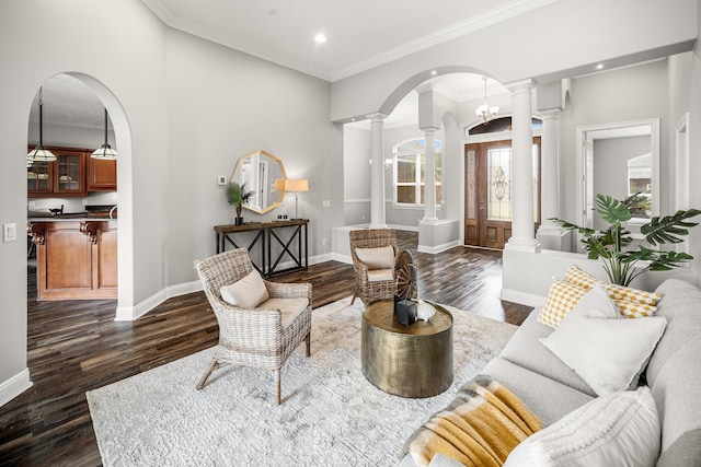 203 Landings Dr, Lynn Haven, FL 32444 - living room featuring decorative columns, arched walkways, dark wood finished floors, baseboards, and recessed lighting