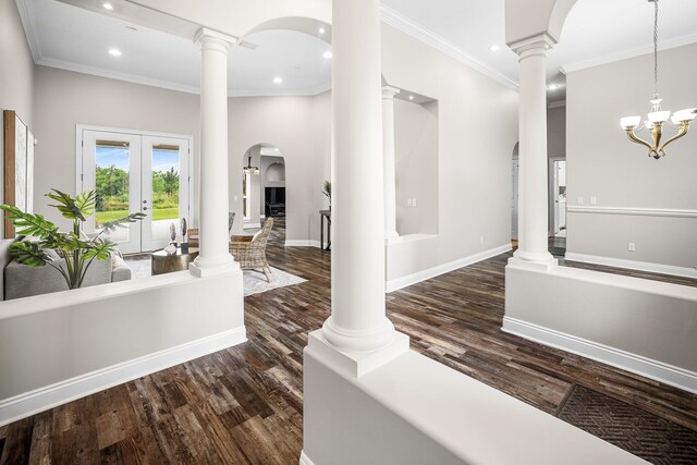 203 Landings Dr, Lynn Haven, FL 32444 - hallway featuring recessed lighting, dark wood-type flooring, ornamental molding, french doors, and arched walkways