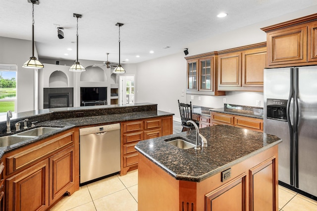 203 Landings Dr, Lynn Haven, FL 32444 - kitchen with stainless steel appliances, a sink, brown cabinets, and recessed lighting