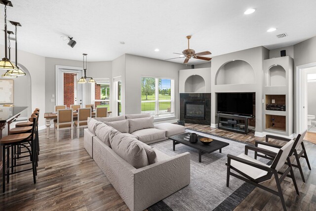 203 Landings Dr, Lynn Haven, FL 32444 - living area with wood finished floors, recessed lighting, a ceiling fan, baseboards, and built in shelves