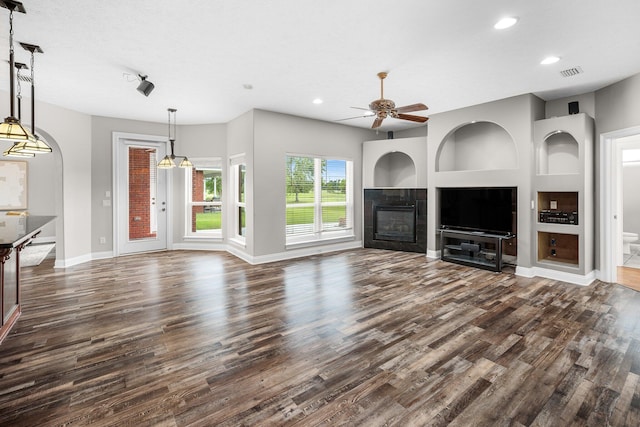 203 Landings Dr, Lynn Haven, FL 32444 - unfurnished living room with dark wood-style flooring, recessed lighting, a ceiling fan, baseboards, and a fireplace