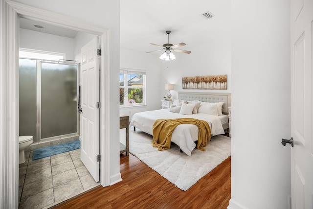 203 Landings Dr, Lynn Haven, FL 32444 - bedroom featuring wood finished floors, a ceiling fan, and baseboards