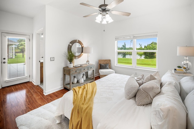 203 Landings Dr, Lynn Haven, FL 32444 - bedroom featuring access to outside, a water view, multiple windows, and wood finished floors