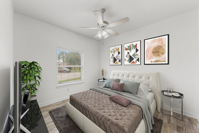 203 Landings Dr, Lynn Haven, FL 32444 - bedroom with light wood finished floors, baseboards, and a ceiling fan