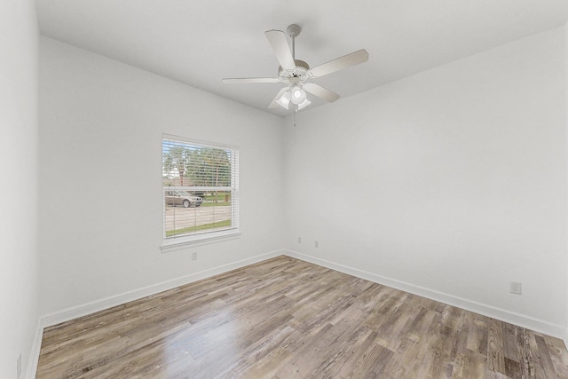 203 Landings Dr, Lynn Haven, FL 32444 - unfurnished room featuring wood finished floors, a ceiling fan, and baseboards