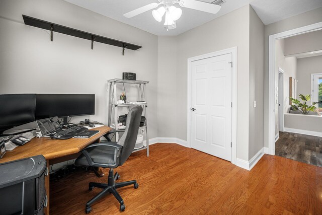 203 Landings Dr, Lynn Haven, FL 32444 - office area featuring a ceiling fan, wood finished floors, and baseboards