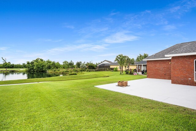 203 Landings Dr, Lynn Haven, FL 32444 - view of grassy yard with a water view, a patio, and an outdoor fire pit