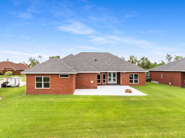 203 Landings Dr, Lynn Haven, FL 32444 - rear view of property featuring a patio area, roof with shingles, french doors, a yard, and brick siding