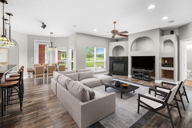 203 Landings Dr, Lynn Haven, FL 32444 - living area with wood finished floors, recessed lighting, a ceiling fan, baseboards, and built in shelves