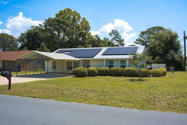 74 8th St, Shalimar, FL 32579 - single story home featuring a front yard, roof mounted solar panels, and concrete driveway