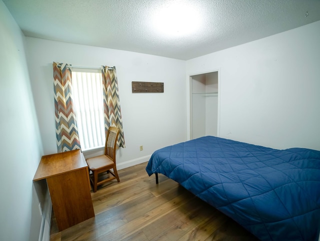 74 8th St, Shalimar, FL 32579 - bedroom featuring hardwood / wood-style floors and a textured ceiling