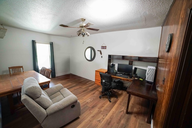 74 8th St, Shalimar, FL 32579 - office space with a textured ceiling, wood finished floors, and ceiling fan