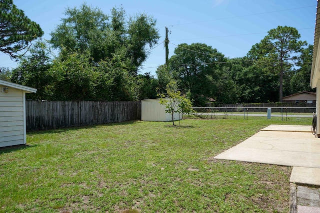 74 8th St, Shalimar, FL 32579 - fenced backyard with a shed and a patio