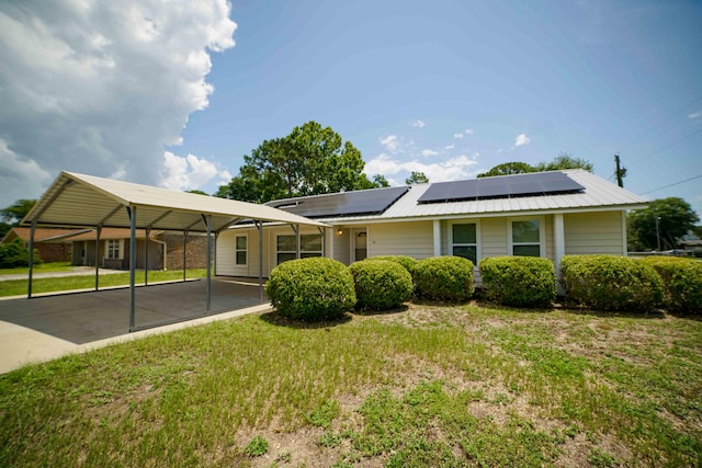 74 8th St, Shalimar, FL 32579 - single story home with solar panels and a front yard