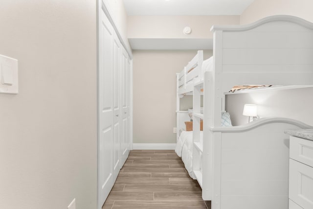 17281 Front Beach Rd Unit 1206, Panama City Beach, FL 32413 - bedroom with light wood-type flooring and a closet