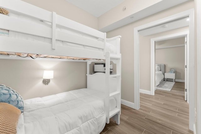 17281 Front Beach Rd Unit 1206, Panama City Beach, FL 32413 - bedroom featuring wood tiled floors and baseboards