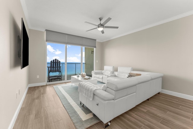 17281 Front Beach Rd Unit 1206, Panama City Beach, FL 32413 - living room with light wood-style floors, ceiling fan, and ornamental molding