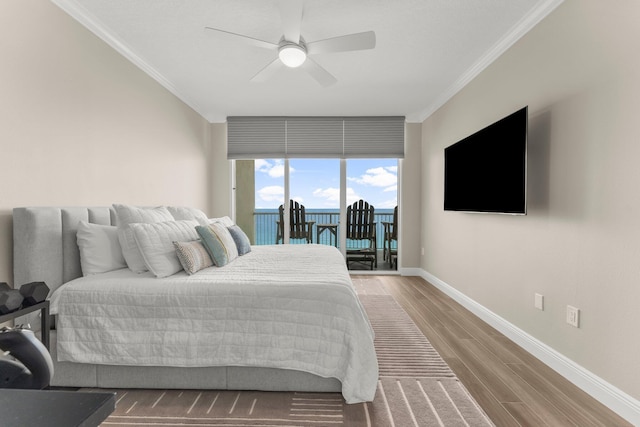17281 Front Beach Rd Unit 1206, Panama City Beach, FL 32413 - bedroom featuring ornamental molding, access to exterior, wood finished floors, and a ceiling fan
