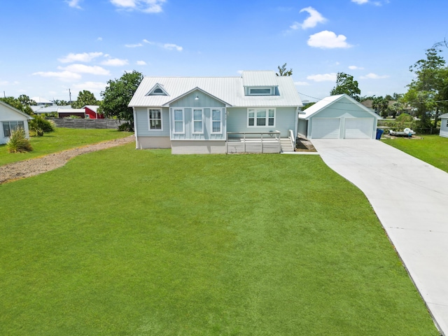 413 Colorado Dr, Mexico Beach, FL 32456 - view of front facade with a detached garage, metal roof, and an outdoor structure