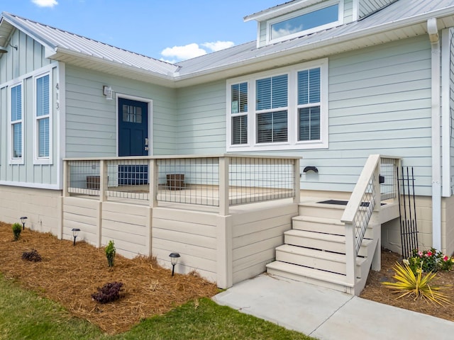 413 Colorado Dr, Mexico Beach, FL 32456 - view of property exterior featuring metal roof and stairs