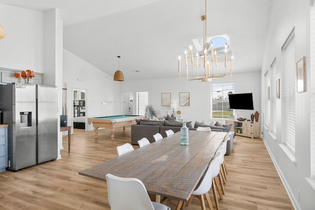 413 Colorado Dr, Mexico Beach, FL 32456 - dining area featuring high vaulted ceiling, billiards, light wood finished floors, and a chandelier