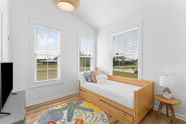 413 Colorado Dr, Mexico Beach, FL 32456 - bedroom with vaulted ceiling, light wood-style floors, and baseboards