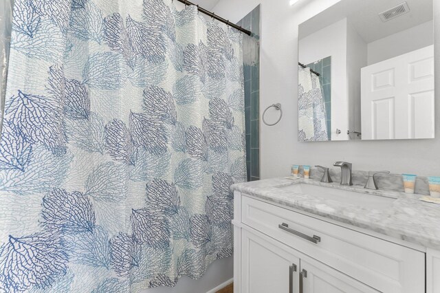 413 Colorado Dr, Mexico Beach, FL 32456 - bathroom featuring vanity and curtained shower