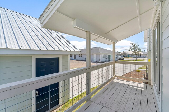 413 Colorado Dr, Mexico Beach, FL 32456 - wooden terrace with a residential view